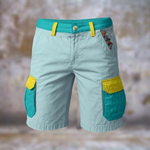 May include: Light blue cargo shorts with teal and yellow accents. The shorts feature teal pockets with yellow flaps, a teal waistband, and yellow belt loops. A small embroidered design of cartoon characters is visible on the right pocket.