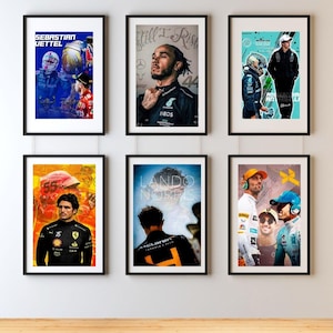 May include: Six framed posters featuring Formula 1 drivers. The posters showcase portraits of Sebastian Vettel, Lewis Hamilton, Carlos Sainz Jr., Lando Norris, and other racers. Each poster has a black frame and is displayed against a neutral wall.