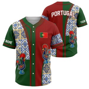 May include: A baseball jersey with a red, green, and white design, featuring the word "PORTUGAL" on the back. The front displays the Portuguese flag and a rooster graphic. The sleeves have a blue and white tile pattern.