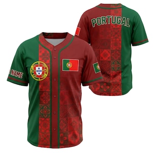 May include: A baseball jersey featuring the colors of the Portuguese flag. The jersey is primarily red with green accents on the sleeves and sides. The front displays the Portuguese coat of arms and flag, with the word "NAME" on the sleeve.