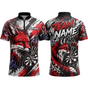 May include: A short-sleeved dart shirt with a red fox design, dartboard, and darts. The shirt has a black collar and a zip. The front of the shirt has the text "YOUR NAME", while the back says "TEAM NAME". The shirt is red, black, and white.