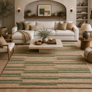 May include: A living room with a beige and green striped rug, a white sofa with cushions, and a square marble coffee table. The room is decorated in neutral tones with natural elements. The rug's dimensions are approximately 240 cm x 300 cm.