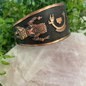 May include: A handmade, wooden serving tray with a natural finish. The tray features a rectangular shape with raised edges and two handles. The wood grain is visible, showcasing the tray's rustic charm. Perfect for serving food or displaying decorative items.