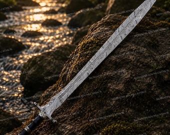 May include: A double-edged sword featuring a long, pointed blade with a distinct wavy Damascus steel pattern. The hilt includes a metallic crossguard, a black cylindrical grip with silver-toned accents, and a decorative pommel at the base.
