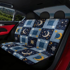 May include: A blue car seat cover with a patchwork design featuring moons, stars, and clouds. The celestial pattern is in shades of blue, with yellow and white accents. The cover is designed to fit the back seat of a car.
