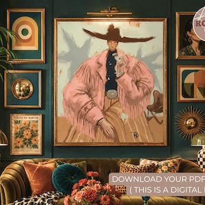 Puede incluir: Una escena de diseño de interiores con una gran pintura enmarcada de una persona con una chaqueta rosa con flecos y un sombrero de vaquero. Otras obras de arte enmarcadas y objetos decorativos adornan la pared verde azulado. Un sofá de terciopelo con cojines y una manta estampada está en primer plano. El texto "DOWNLOAD YOUR PDF ART (THIS IS A DIGITAL FILE)" es visible.