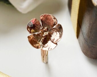 Dainty Rose gold blossom ring, inspired by spring blossoms, it is hand forged and hammered from sheet rose gold, UK size P but can be sized.