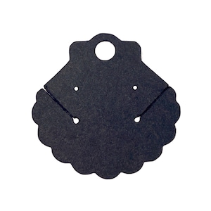 May include: A black earring display card with a scalloped edge and a hole at the top for hanging. The card has two pairs of pre-cut slits for holding earrings. The card is made of a thick, textured paper.