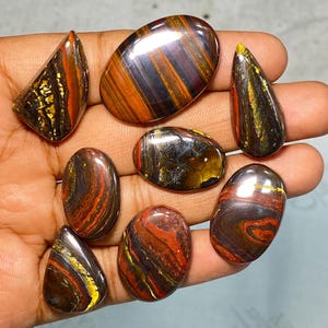 7 Psc Iron Tiger Eye Il Tiger Iron di alta qualità è una combinazione di occhio di tigre, ematite e pietra di tigre diaspro rosso da 199,60 carati. Dimensioni miste