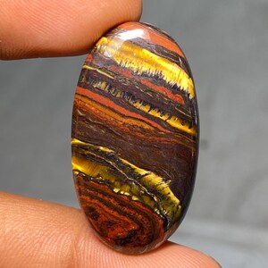 Occhio di tigre in ferro naturale 36x20x5 mm Il ferro di tigre è una combinazione di occhio di tigre, ematite e pietra di diaspro rosso da 40,50 carati