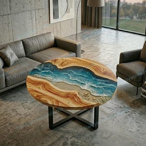 May include: Round wooden coffee table with a unique ocean-themed resin design. The table features a light brown wood grain with a blue and white resin ocean scene, complete with sand and starfish. The table is supported by a black metal base.