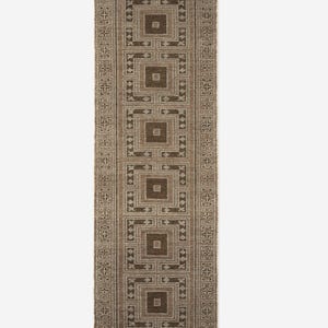 May include: A rectangular brown and beige patterned rug with a repeating geometric design. The rug features a series of squares within squares, creating a symmetrical pattern. The edges are finished with a fringe.