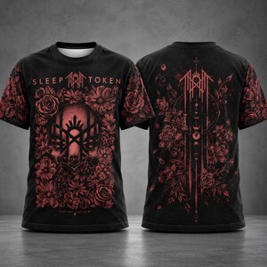 May include: A black short-sleeve t-shirt featuring a red graphic print. The front displays the text SLEEP TOKEN above a stylized face surrounded by flowers. The back shows a vertical arrangement of moon phases and floral patterns.