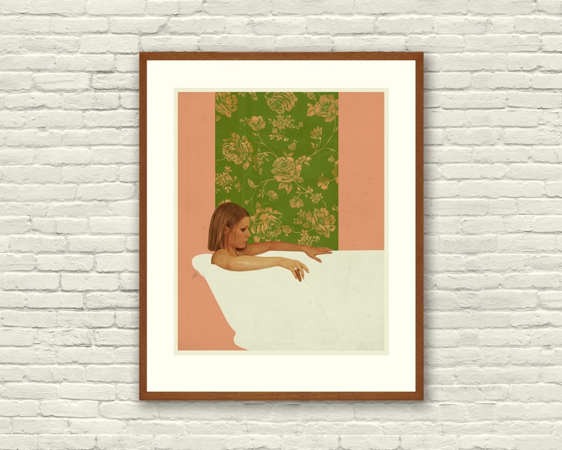 May include: A woman in a bathtub with a floral wallpaper behind her. The wallpaper is green with gold flowers. The woman is looking down and her hand is reaching out of the water.