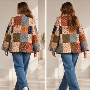 May include: A quilted jacket featuring a patchwork design of various floral patterns in shades of rust, navy blue, olive green, and cream, paired with blue denim jeans. The jacket has long sleeves and a boxy fit, showcasing a stitched diamond pattern.