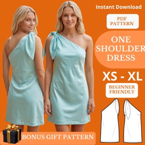 May include: Two women model a light blue one-shoulder dress. The dress has a bow detail on the shoulder. Text on the image reads "ONE SHOULDER DRESS" and "XS - XL". The image also includes the text "BEGINNER FRIENDLY" and "BONUS GIFT PATTERN".