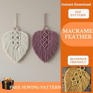 May include: Two macrame feather wall hangings, one white and one purple, are displayed against a gray wall. Each feather has a wooden ring and a hanging loop. The image includes text that says "Instant Download PDF Pattern" and "Macrame Feather".