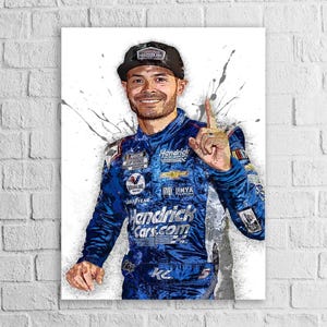 May include: Portrait of a smiling man in a blue racing suit and a black cap, raising one finger. The suit features sponsor logos and the text "HendrickCars.com". The background has gray paint splatters.