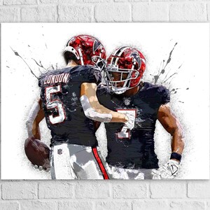 May include: An artistic rendering of two football players in action. They are wearing black and red helmets and jerseys with the numbers 5 and 7. The image has a watercolor effect with paint splatters.