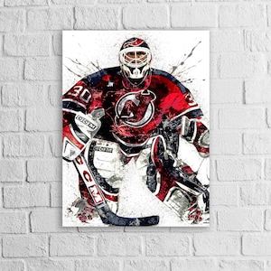 May include: A canvas print of a hockey goalie in a red and black uniform with the number 30. The goalie is in a defensive stance, with a hockey stick in hand. The image has a watercolor effect with paint splatters.
