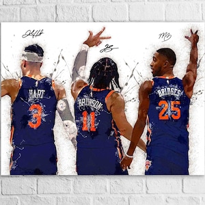 May include: A digital art print featuring three basketball players in navy blue jerseys with orange numbers. The players are seen from the back, with their names and numbers visible. The artwork has a textured, painterly style with white and gray splatter effects.