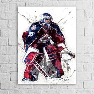 May include: Abstract art print of a hockey goalie in a blue, burgundy, and white uniform. The artwork features a splatter paint effect, with the goalie in a defensive stance. The print includes the number 33.
