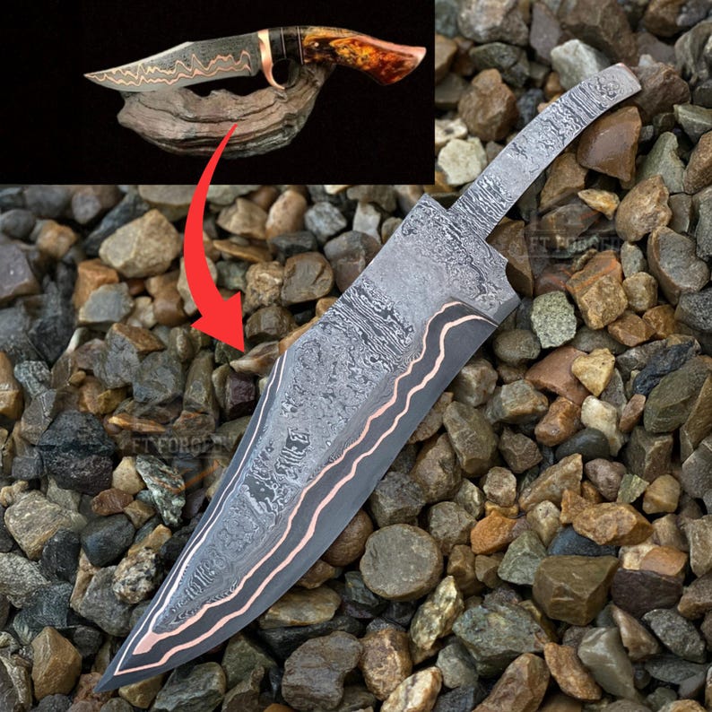 May include: A large, ornate knife with a patterned blade and copper accents. The blade has a unique design, and the handle appears to be made of wood and other materials. The knife is displayed on a bed of small rocks.