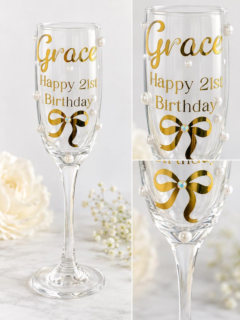 May include: A clear glass champagne flute featuring gold lettering that reads Grace Happy 21st Birthday. The glass is decorated with a gold foil bow graphic with a central iridescent crystal accent and several small white faux pearls attached to the exterior.