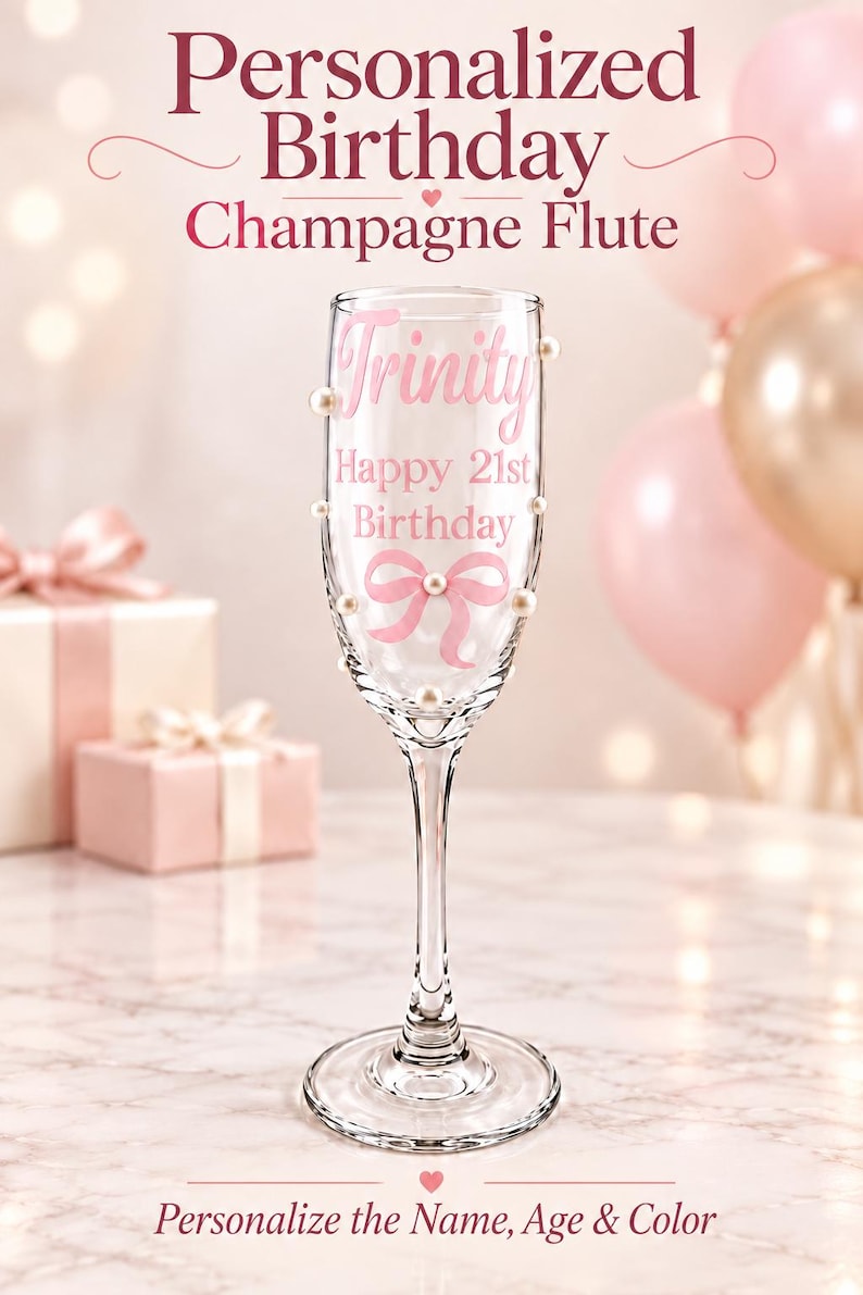 May include: A clear glass champagne flute decorated with small white pearls and a pink bow graphic. The glass features the text Trinity, Happy 21st Birthday in pink lettering. The top of the image displays Personalized Birthday Champagne Flute.