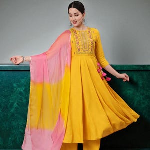 Rayon Calf Length Embroidered Flared 3/4 Sleeve Round Neck Kurta Set.