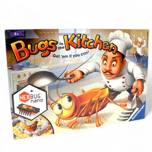May include: A Bugs in the Kitchen board game box. The box features a cartoon chef chasing a large orange cockroach. The game's title is displayed in large, colorful letters, with the text "Get 'em if you can!"