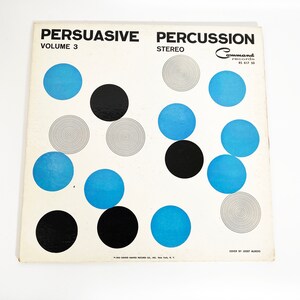 May include: Vinyl record cover with a white background and a geometric pattern of black and blue circles. The title "PERSUASIVE PERCUSSION VOLUME 3" is printed in black at the top of the cover. The record label is "Command Records" and the record number is "RS 817 50".