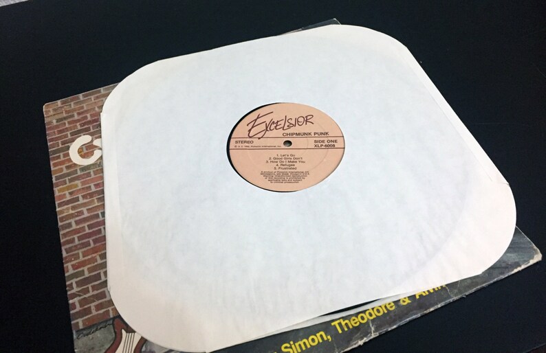 May include: A white vinyl record sleeve with a brown label that says "Excelsior Chipmunk Punk Side One XLP-6008". The label also lists the song titles "I Love To", "You're So Sweet", "How Can I Thank You", "I'm Yours", and "Meltdown".