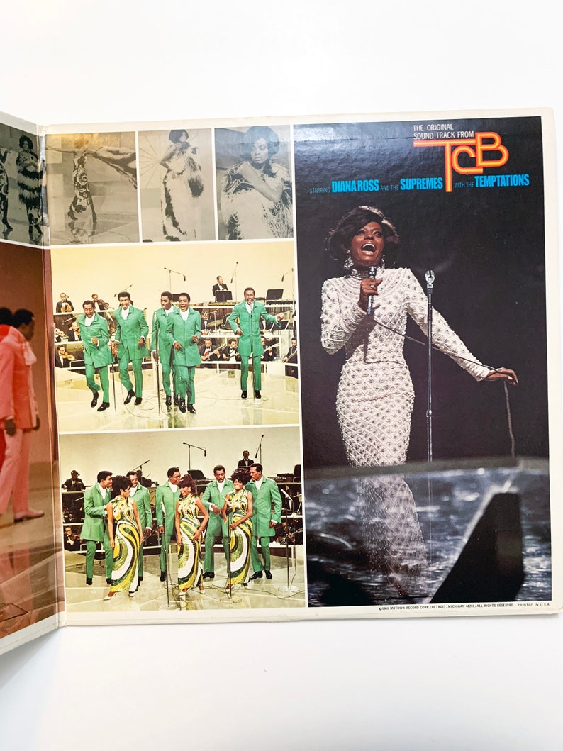 May include: A vintage vinyl record album cover featuring Diana Ross and the Supremes with the Temptations. The cover features a black and white photo of Diana Ross singing on stage. The album title is "T.C.B." and the text "The Original Sound Track From" is above the title. The album cover is in a retro style.