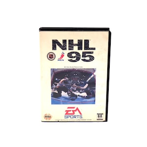 May include: A vintage video game cartridge for NHL '95. The cover features the game's title in white and black, a hockey scene, and the EA Sports logo. The cartridge is black with a white label.