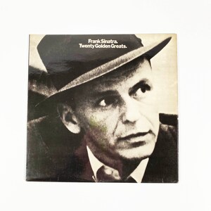 May include: Black and white photo of Frank Sinatra on a record album cover. The album title is "Frank Sinatra. Twenty Golden Greats."