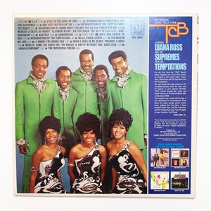 May include: A vintage vinyl record cover featuring Diana Ross and The Supremes with The Temptations. The cover is a vibrant mix of green, black, and white. The image shows the singers in a studio setting, with Diana Ross in the centre. The album title is "TCB" and the text "The Original Sound Track From" is printed in white on a black background.