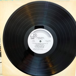 May include: Black vinyl record with a white label. The label has a bell icon and the text "Original Motion Picture Soundtrack Godspell 1118 (THSA) 33 1/3 RPM Side 1". The track list includes "Prepare Ye The Way Of The Lord", "Save The People", "Day By Day", "Turn Back O Man", "Bless The Lord", "All For The Best", and "All Good Gifts".