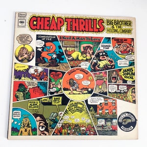 May include: A vintage vinyl record cover for the album "Cheap Thrills" by Big Brother and the Holding Company. The cover features a colorful cartoon illustration with a psychedelic theme. The album title is in large, bold letters and the band's name is listed below. The album cover includes a list of songs on the album, including "Piece of My Heart", "Summertime", "Ball and Chain", and "I Need a Man to Love".
