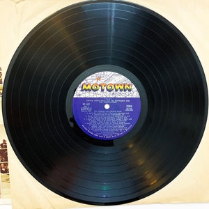 May include: A black vinyl record with a white label featuring the Motown logo and the text "Starring Diana Ross & The Supremes with The Temptations" and "The Original Cast Sound Track" from the movie "T.C.B."