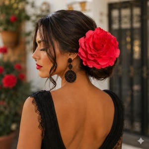 she is wearing a dress in spanish Woman in traditional Spanish dress. She is wearing a shawl and holding a  fan Stock Photo