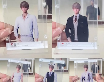 May include: A collection of clear acrylic Instagram-style photo frames, each featuring a different image of a person. The frames have a social media interface design, with icons and text at the bottom. The person in the images is wearing different outfits.