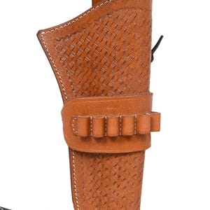 May include: A brown leather holster with a woven pattern and white stitching. The holster has a loop for a belt and a band with six bullet loops. A black leather strap is attached.