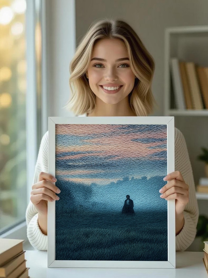 May include: A framed artwork featuring a landscape scene with a figure in the distance. The artwork has a white frame and depicts a field under a blue and pink sky. The image has a textured, painted appearance.
