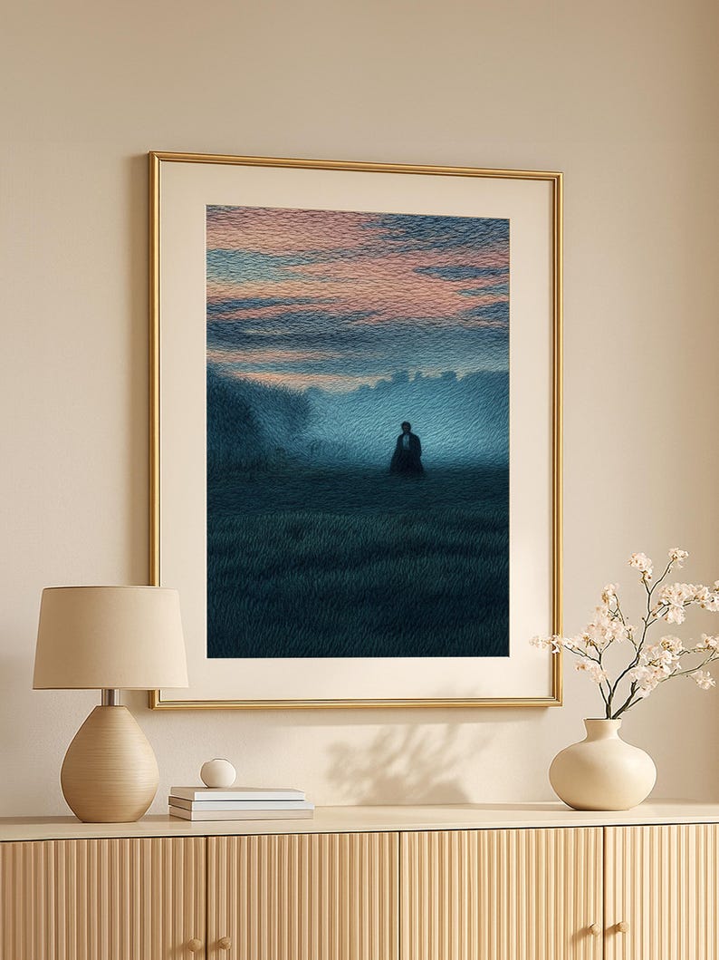 May include: A framed art print depicts a solitary figure in a field at dusk. The artwork features a color palette of blues, greens, and pinks, with a gold frame. The scene evokes a sense of solitude and contemplation, suitable for home decor.