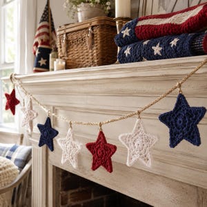 May include: A decorative garland featuring alternating red, white, and blue crocheted stars suspended from a natural jute twine rope. The stars are crafted with a textured yarn pattern and are evenly spaced along the length of the sturdy cord.