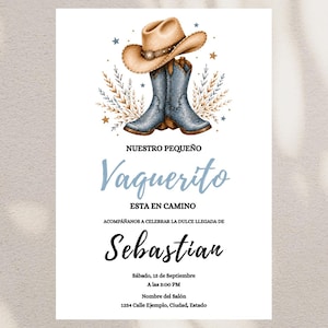 May include: A baby shower invitation card featuring a tan cowboy hat resting on blue cowboy boots, surrounded by wheat stalks and stars. The text reads: NUESTRO PEQUEÑO Vaquerito ESTA EN CAMINO ACOMPÁÑANOS A CELEBRAR LA DULCE LLEGADA DE Sebastian Sábado, 15 de Septiembre A las 3:00 PM Nombre del Salón 1234 Calle Ejemplo, Ciudad, Estado.