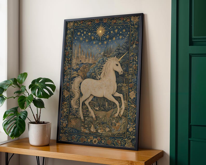 May include: Framed art print featuring a white unicorn with a golden horn, set against a backdrop of a starry night sky, a castle, and a forest. The artwork is framed in a black border and has a floral border.