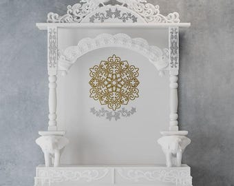 May include: White wooden altar with intricate carvings, featuring two peacocks at the top. The altar has a gold and white mandala design in the center, with elephant figurines at the base. The design is ornate and detailed.