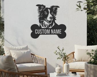 May include: Black metal dog silhouette wall art featuring a Border Collie with a bone-shaped plaque that reads "CUSTOM NAME". The dog's head is detailed with fur and facial features. The art is mounted on a white wall, suitable for indoor or outdoor decor.
